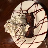 Homemade Brownie Freakout · a warm homemade brownie 
topped with vanilla bean ice cream, 
chocolate syrup and whipped cr...