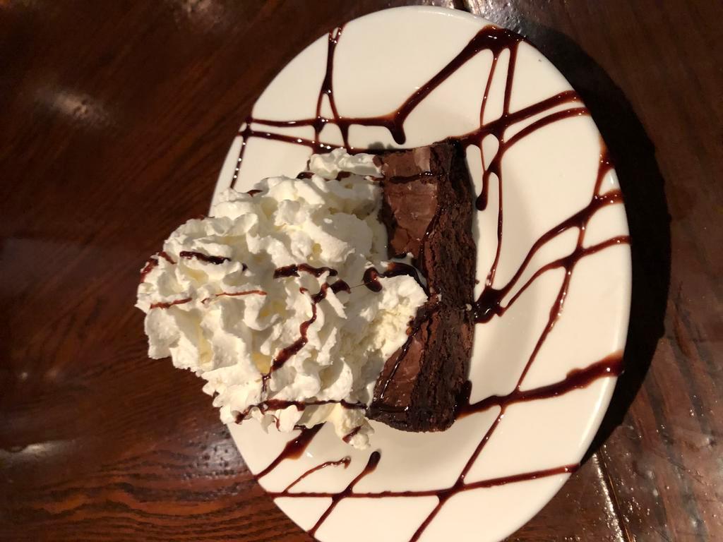Homemade Brownie Freakout · a warm homemade brownie 
topped with vanilla bean ice cream, 
chocolate syrup and whipped cream
