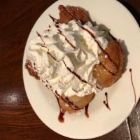 Deep Fried Oreo's · 4 Oreo cookies battered and fried golden brown topped with vanilla ice cream