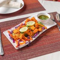 Amritsari Fish · Pieces of basa fish coated with chickpea batter and deep-fried. Served with chutney.
