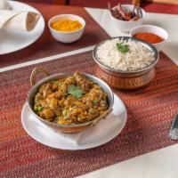 Baingan Bharta · An eggplant specialty baked over an open flame, mashed then sauteed with onions, tomato, gar...