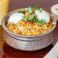 Chef's Special Biryani · Basmati rice sauteed in butter cooked with shrimp, chicken, lamb, tomatoes, almonds, cashews...