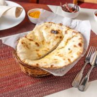 Cheese Naan · Leavened white flour bread stuffed with fresh home-made cheese then baked in a tandoor.