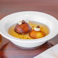 Gulab Jamun · Condensed milk and homemade cheese balls deep fried in butter with syrup.