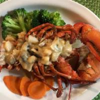 Stuffed Lobster  · Fresh whole 1.5 lbs lobster stuffed with sautéed shrimp, scallops and mushrooms with our sea...