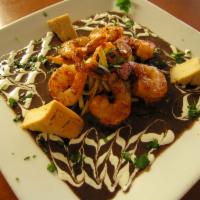 Shrimp Diablo Viejo · Spicy Shrimp, Black Bean Caldo, dirty rice, plantain straws