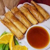 Shrimp Rolls · Chicken and shrimp wrapped with egg roll skin.  6 pieces.