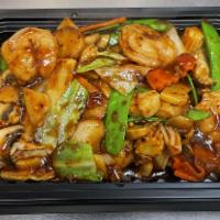CS21. Shrimp and Scallops Szechuan Style · Sauteed with Chinese cabbage, baby corn, snow peas, mushrooms, bamboo shoots, carrots, and w...