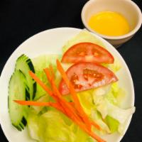 House Salad · Iceberg lettuce ,tomato and cucumber, carrots  with ginger sauce or vinaigrette sauce.