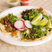 Taco · Diced onions, fresh cilantro, house made salsa and choice of meat.