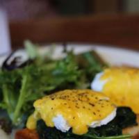 Eggs Benedict w/ Avocado · Poached eggs on toasted bread with fanned avocado and hollandaise sauce served with a side o...