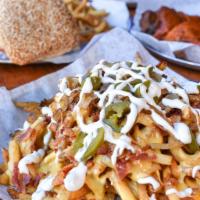 Loaded Cheese Fries · House blended dry rub, cheese fondue, house cured bacon, pickled jalapenos, caramelized onio...