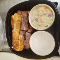 Beef Brisket Sandwich with 2 Sides · Beef sandwich served on Texas toast with 2 sides.