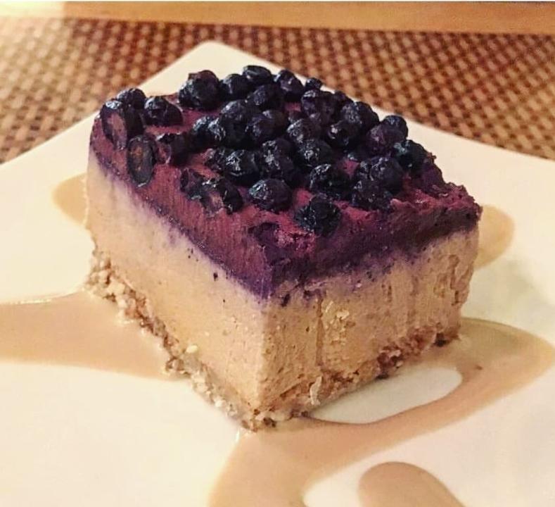 Blueberry Cheesecake Slice · Ingrediants: Almonds, Cashews, Coconut,
Date, Vanilla, Sea Salt, Lemon, Coconut Oil,
Coconut Milk, Strawberries