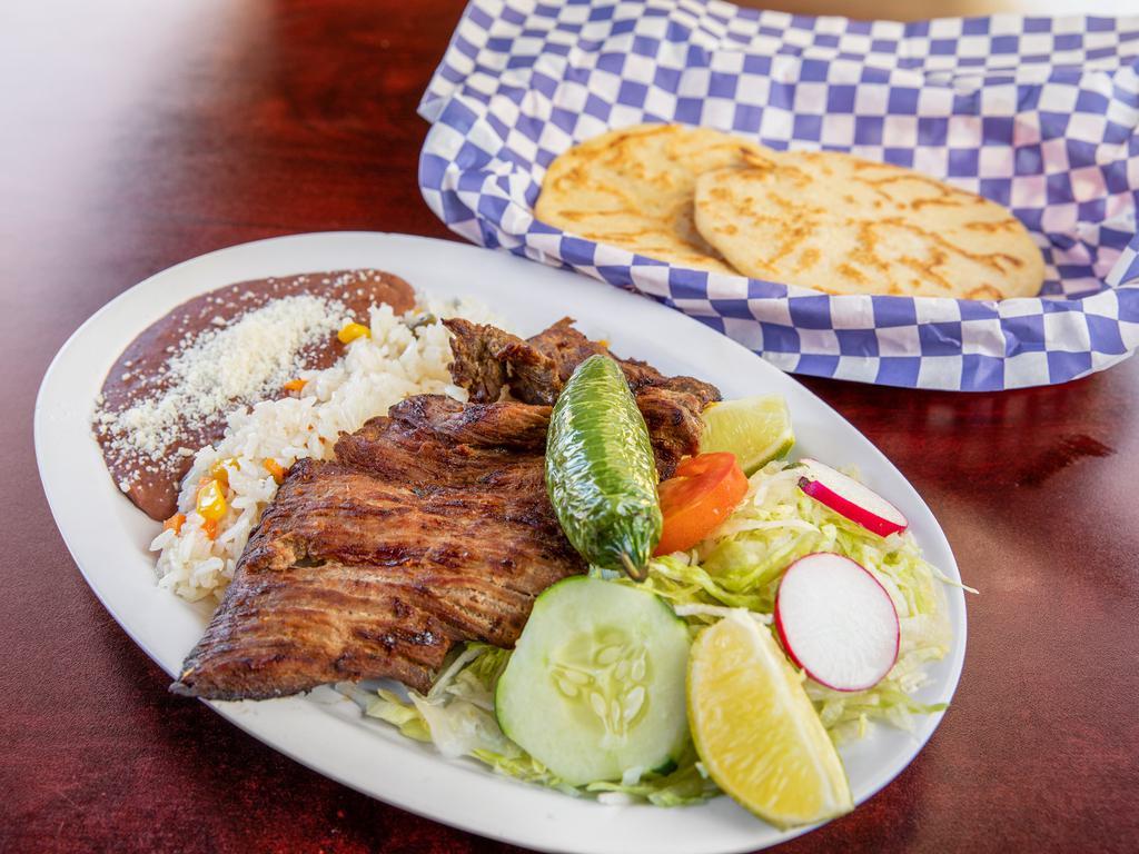 Carne Azada  · Grilled ranchera steak, served with rice, beans, pico de gallo and fresh tortillas.