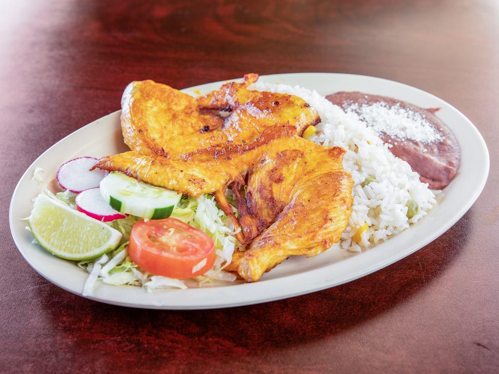 Pollo ala Plancha  · Grilled chicken breast served with rice, beans fresh salad and hand made tortilla.