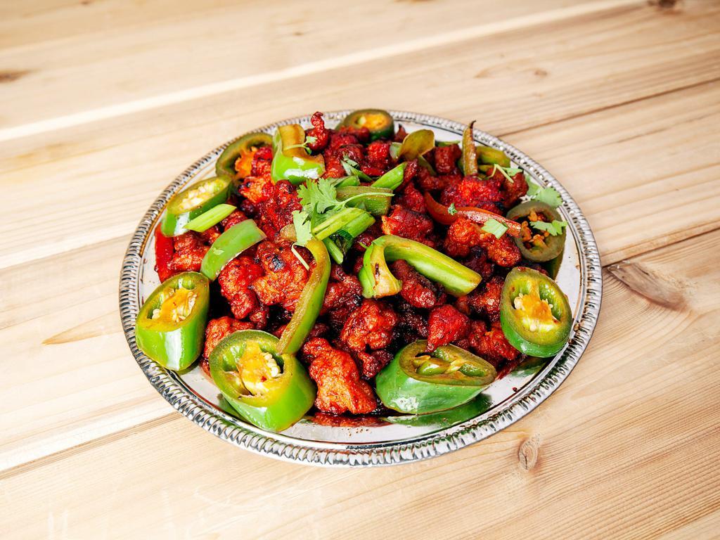 Chili Chicken Entree · Fried chicken cooked with chilies and spicy sauce. Served with rice.