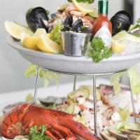 Seafood Tower · Oysters, clams, jumbo shrimp and seafood salad.