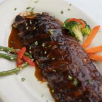 BBQ Baby Back Ribs · Includes choice of side.
