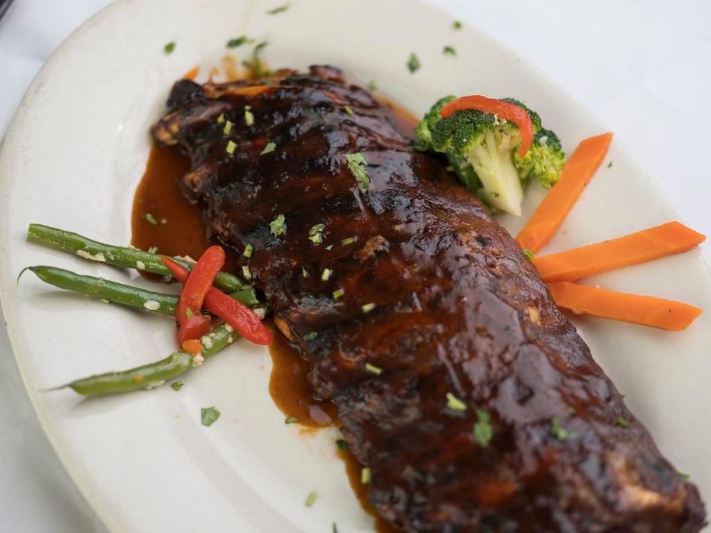 BBQ Baby Back Ribs · Includes choice of side.