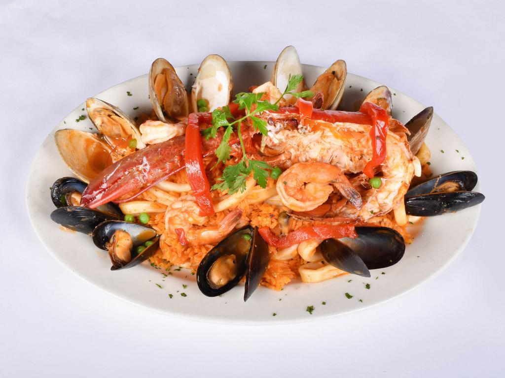 Seafood Paella · Rice with shrimp, clams, mussels, lobster and calamari.