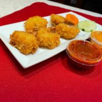 Shrimp Pakora · Lightly breaded and fried shrimps tossed with spices. Served with spicy sauce.