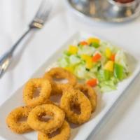 Calamari · Tender calamari lightly breaded and fried. Served with spicy sauce.