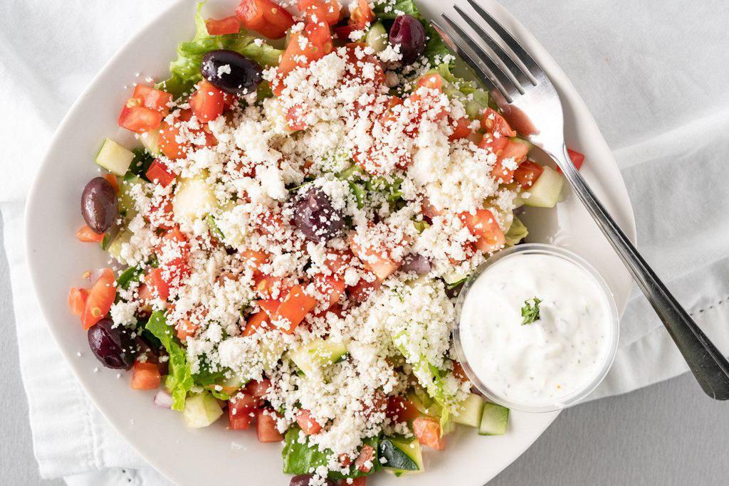 Greek Salad · Romaine lettuce, tomato, cucumber, onion, black olives and feta cheese. Comes with side of tzatziki sauce and house vinaigrette dressing.