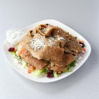 Lamb Gyro Salad · Hand shaved gyro meat served over a Greek salad with tzatziki sauce, feta, black olives, and...