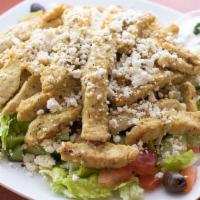 Chicken Shawarma Salad · Chicken breast slices sautéed in our special shawarma spices. Served over a Greek salad and ...
