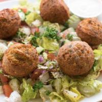 Falafel Salad · Deep fried chickpea patties served over a mixed salad. romaine, tomato, cucumber, onion, gar...