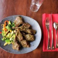 Mehak's Lamb Chop · Tender lamb chops, overnight marinate, ginger, and cilantro. Prepared in a clay-oven and ser...