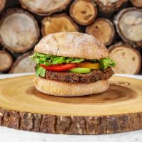 Veggie Burger  · Black bean burger, avocado, tomato, mixed greens, truffle mustard on a rustic Italian bun.