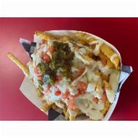3 Amigos Fries · Taco seasoning, cheddar sauce, tomato, onion, jalapeno, tangy pickle ranch.
