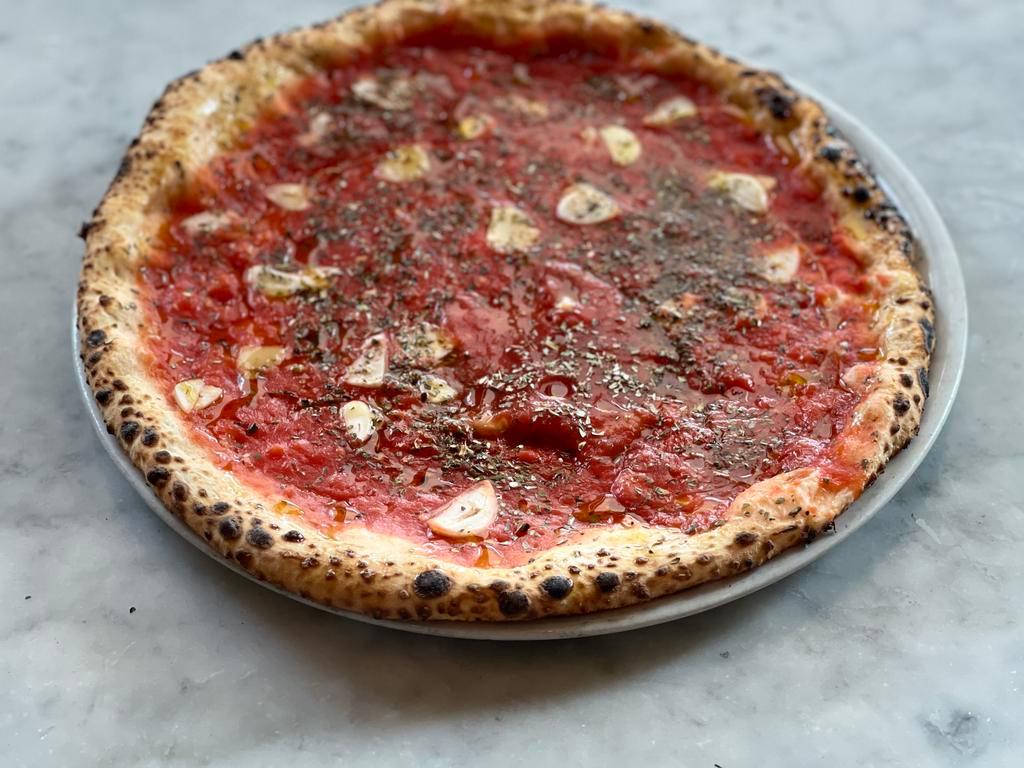 Marinara Pizza · Tomato sauce, oregano, garlic and sea salt.