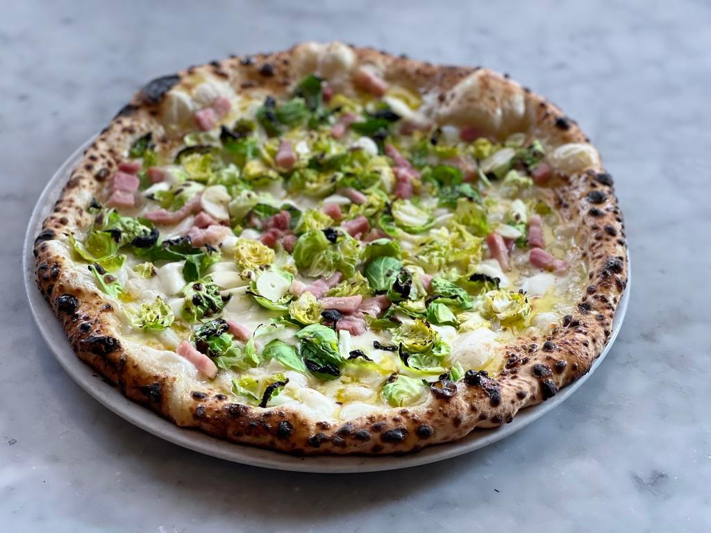 Brussels Sprout Pizza · Fior di latte, garlic, pecorino, smoked pancetta, extra virgin olive oil and Brussels sprout leaves.