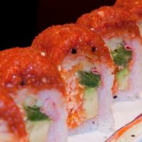 Sneaky Ninja Roll · Spicy crab, jalapeno, cucumber, and avocado topped with spicy tuna, wrapped with soy paper. 