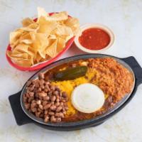 Enchiladas · 3 cheese and onion enchiladas topped with chili and served with pinto beans, Spanish rice a ...