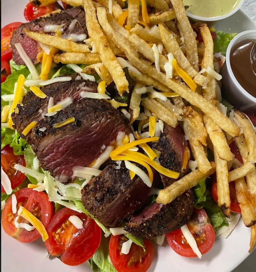 Pittsburgh Salad · Terrace major cooked to perfection on a bed of red leaf lettuce, carrots, cucumber, tomato's and topped with french fries. Choice of dressing.