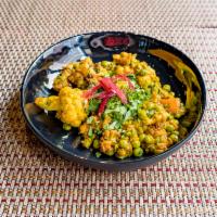 Aloo Gobi · Potatoes and cauliflower florets cooked in ginger, onion, tomato and a blend of Indian spices.