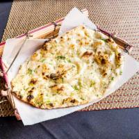 Garlic Naan · Naan topped with fresh garlic and butter.