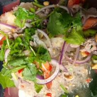 Yum Woon Sen ยำวุ้นเส้น · Spicy glass noodle salad with  ground pork, shrimp, squid, fish ball, peanut, snow fungus mu...