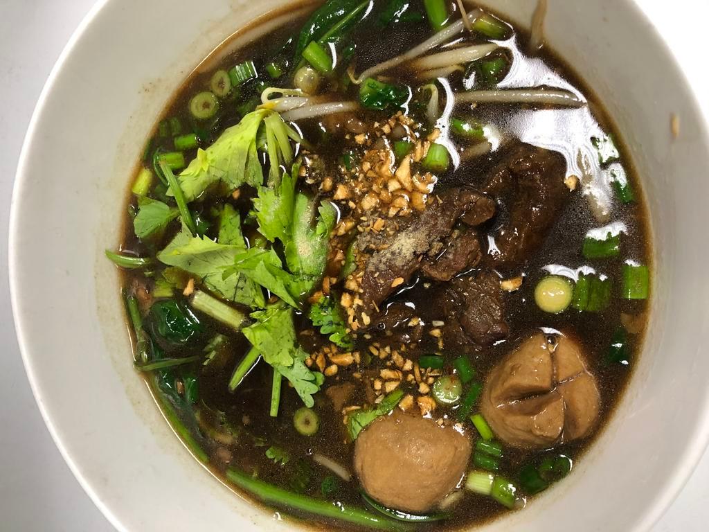 Braised Beef Noodle Soup ก๋วยเตี๋ยวเนื้อตุ๋น · Rice noodle with slow cooked beef and beef ball in dark soup.