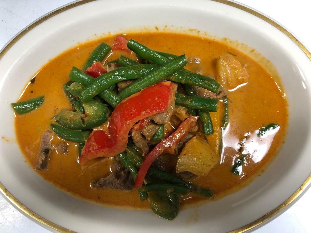 Panang Curry พะแนง · Panang curry paste, bell pepper and coconut milk. Spicy.