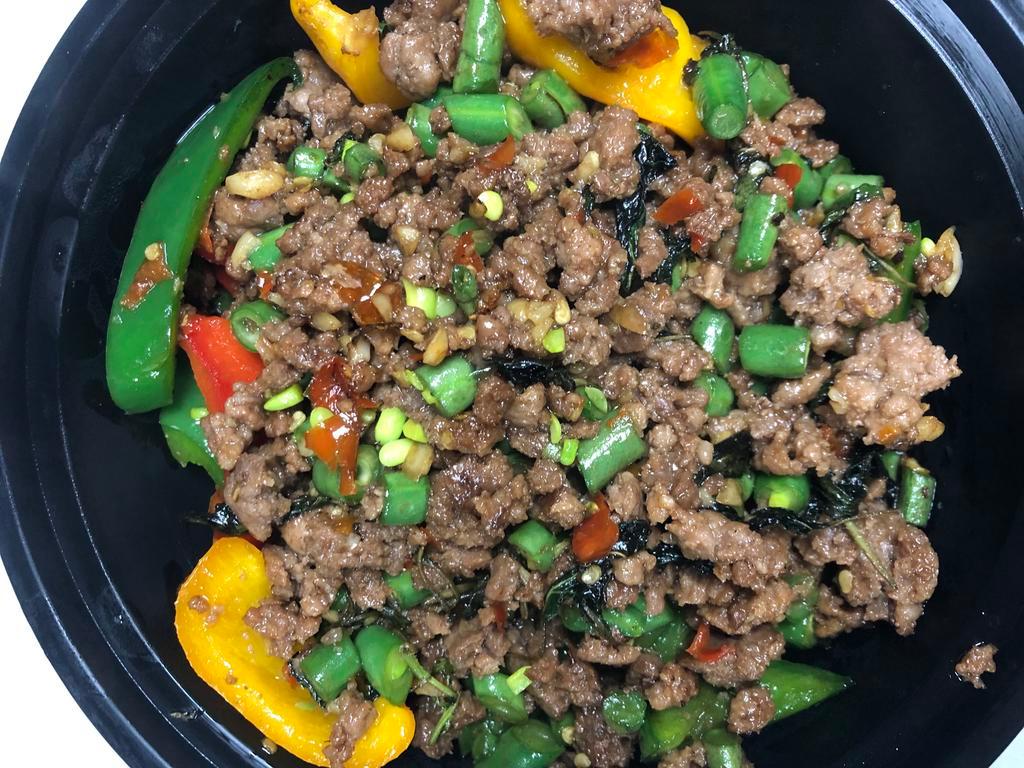 Basil Minced Beef กะเพราเนื้อสับ · (Now we use regular basil instead of Thai holy basil)
Stir-fried minced beef with spicy basil sauce served with Thai omelette. Spicy. 