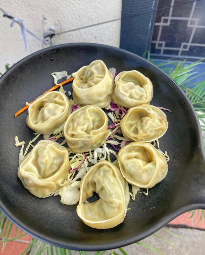 Steamed Dumplings · Steamed dumplings served with dumpling sauce. Vegan friendly. 