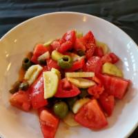 Insalata di Marco Estiva · Marco Summer Salad: vine ripe tomatoes, olives, capers, cucumber, celery, evoo