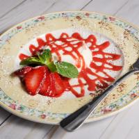 Panna Cotta con Salsa ai Frutti di Bosco · Fresh cream pudding served with wild berry sauce. Gluten free.