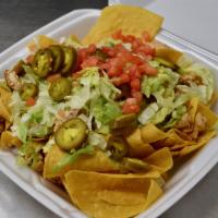 Nacho Platter · Choice of chili, chicken, or pork, melted queso, lettuce, tomato, jalapeño slices, salsa, pi...