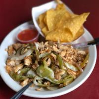 ACP · Grilled chicken, peppers and onions topped with queso on a bed of rice. Served with side of ...
